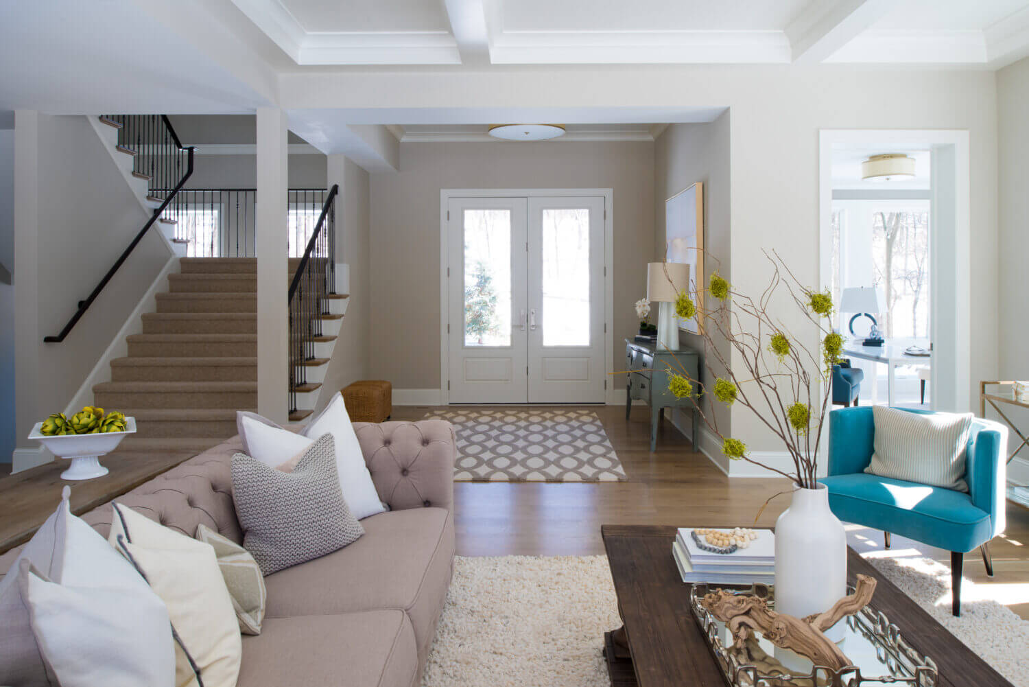 A look across the living room showing the french doors in the front entryway.