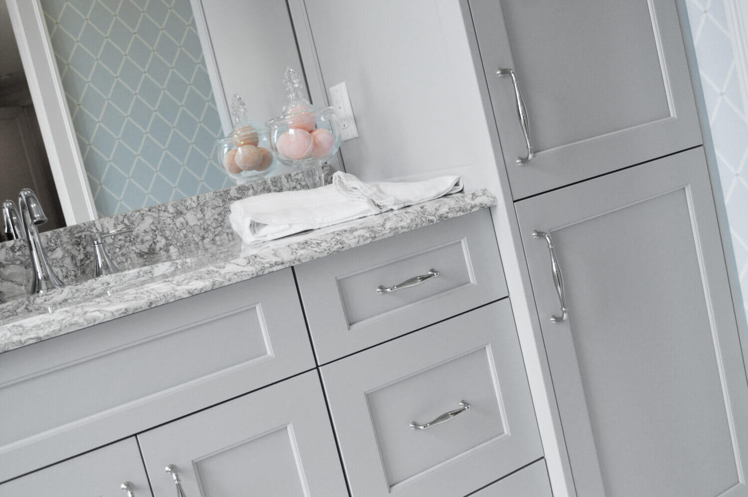 Kitchen and bathroom cabinets for dealers shown in a light gray paint on a bathroom vanity. Dura Supreme is a cabinet company looking for dealers.