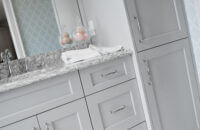 Kitchen and bathroom cabinets for dealers shown in a light gray paint on a bathroom vanity. Dura Supreme is a cabinet company looking for dealers.