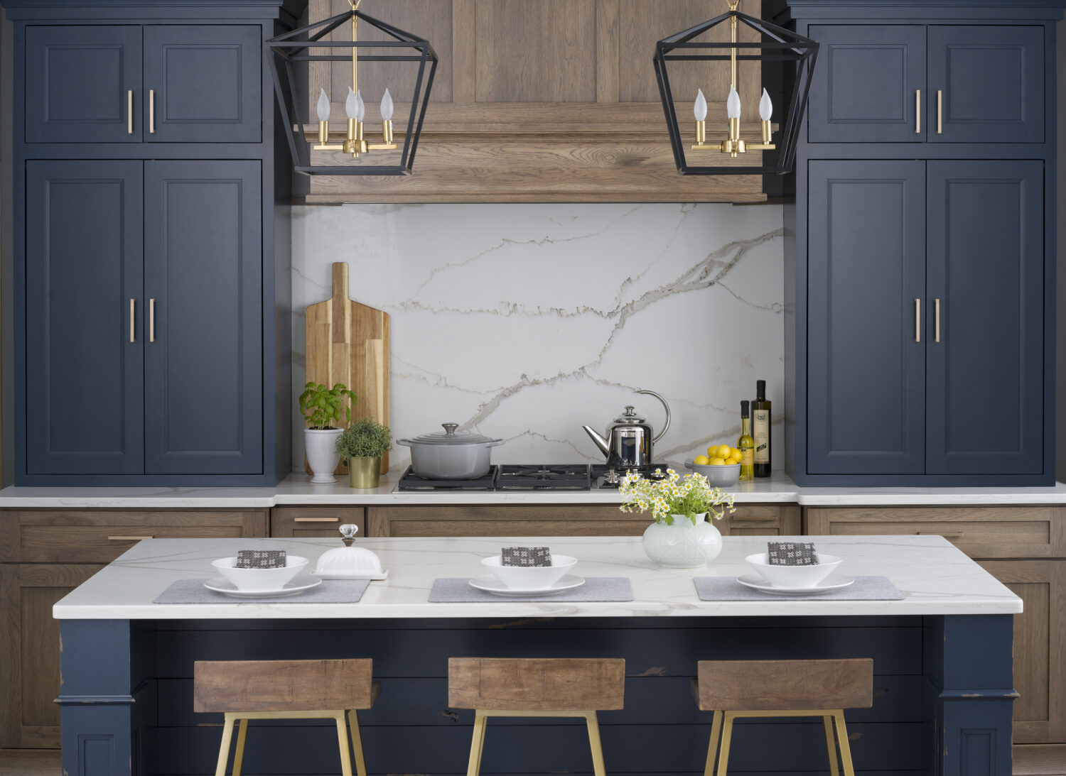 A colorful modern farmhouse kitchen with navy blue and gray stained hickory cabinets and a blue shiplap kitchen island.