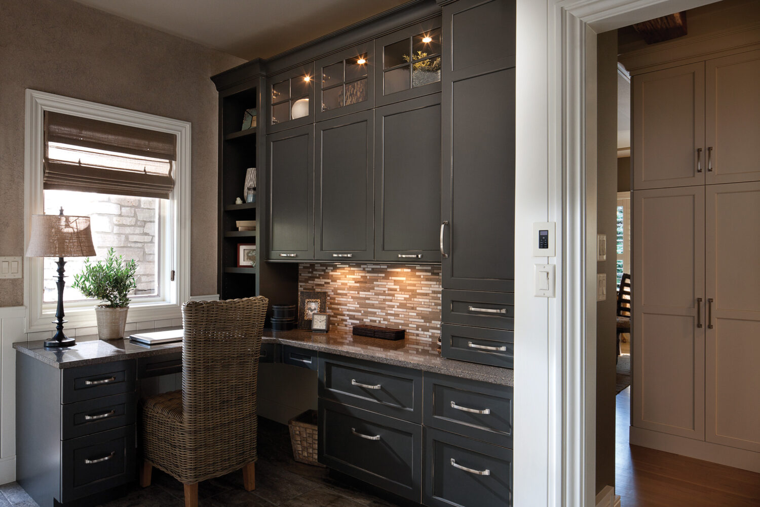 Dura Supreme Cabinetry finished in Graphite paint w/Shadow Glaze on Arcadia door style, Design by Studio M Kitchen & Bath, Plymouth, MN.