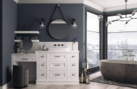 A mountain home master bathroom with cool navy blue and walls and white painted oak bathroom cabinets and vanities from Dura Supreme.
