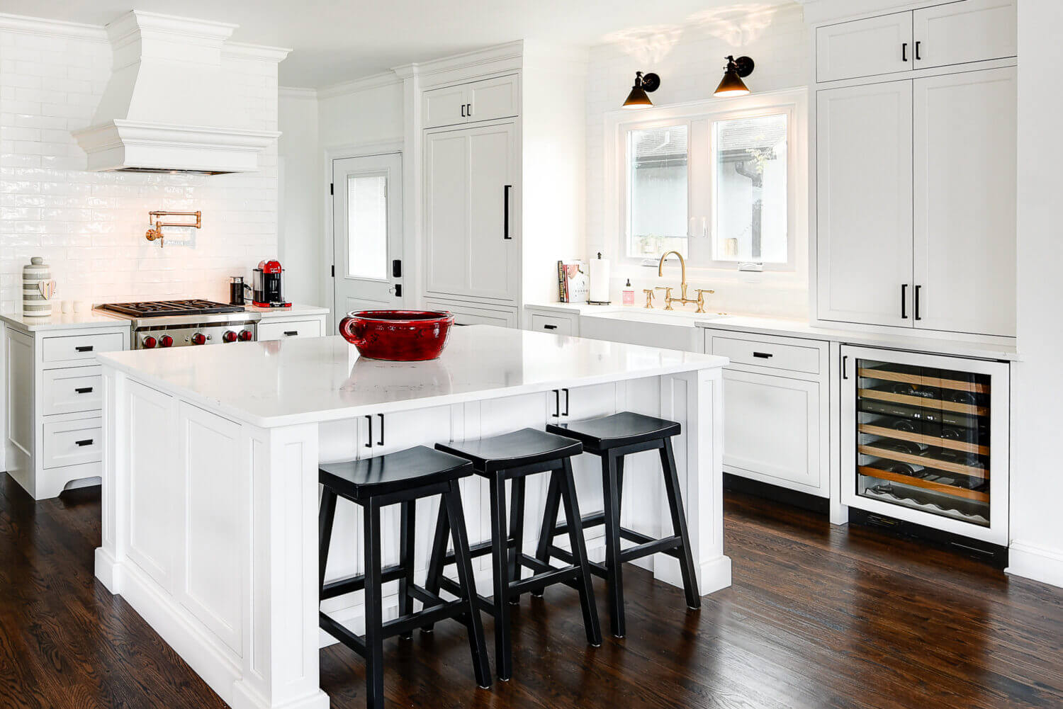 The Dura Supreme Cabinetry throughout this home is shown in Kendall Panel Inset door style (with a non-beaded frame) finished in “White” paint.