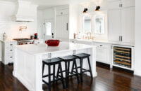 The Dura Supreme Cabinetry throughout this home is shown in Kendall Panel Inset door style (with a non-beaded frame) finished in “White” paint.