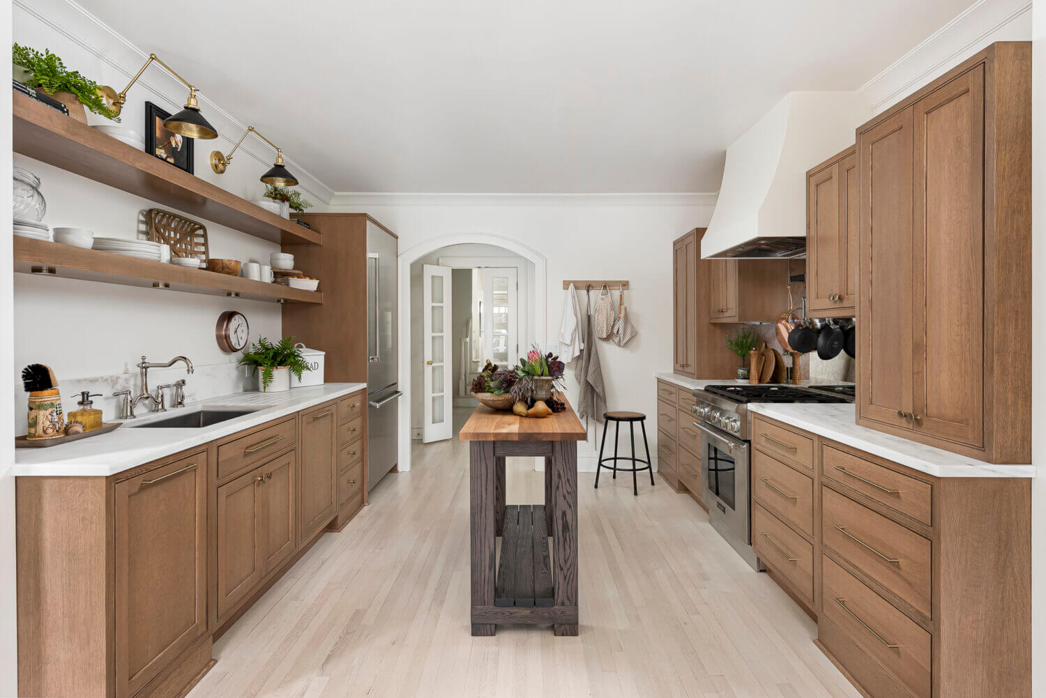 A galley kitchen layout with a thin, tiny kitchen island table.