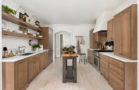 A galley kitchen layout with a thin, tiny kitchen island table.