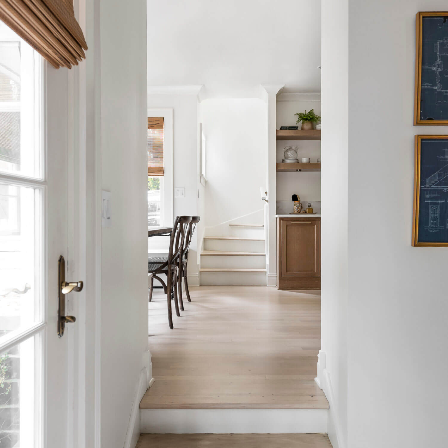 The entrance into the Scandinavian styled kitchen with cabinets from Dura Supreme.