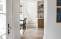 The entrance into the Scandinavian styled kitchen with cabinets from Dura Supreme.