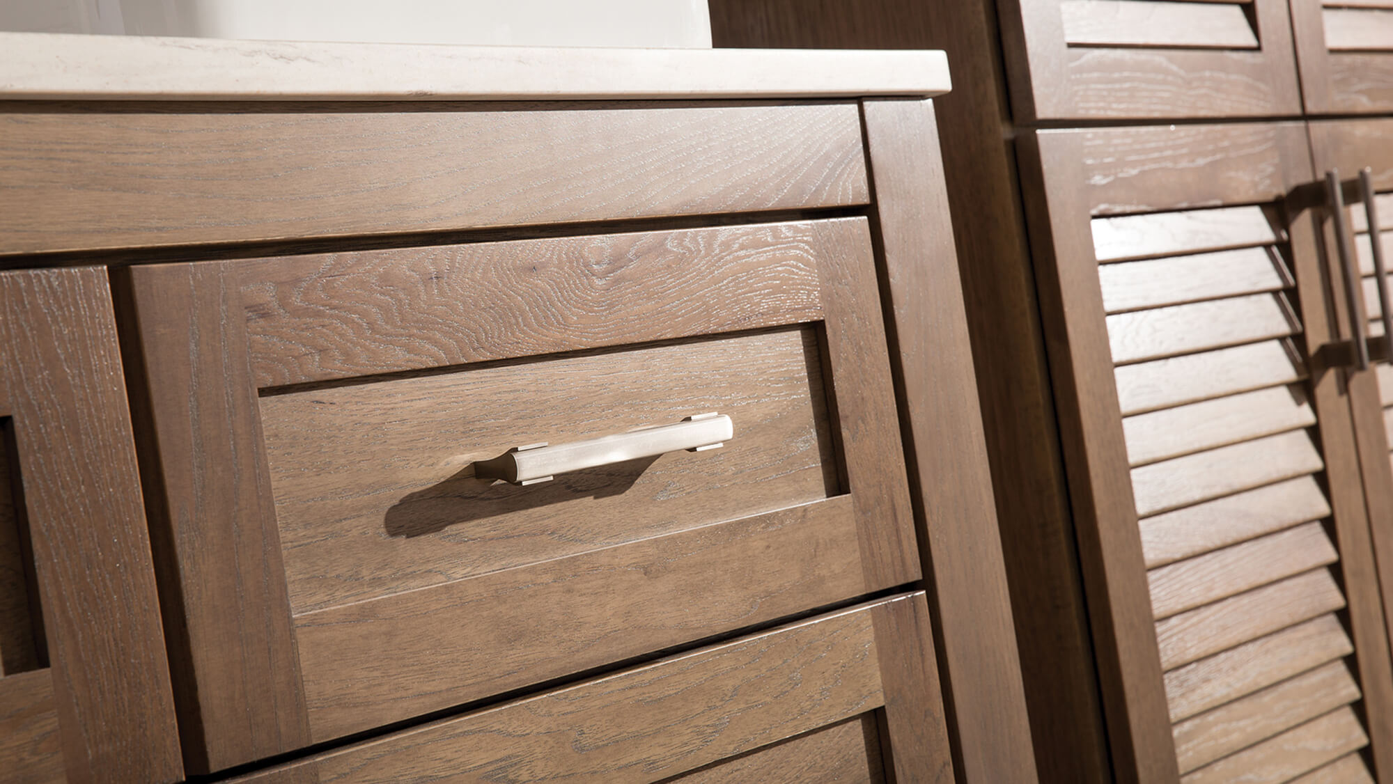 Close up of a light to medium stain finish on cabinets from Dura Supreme.