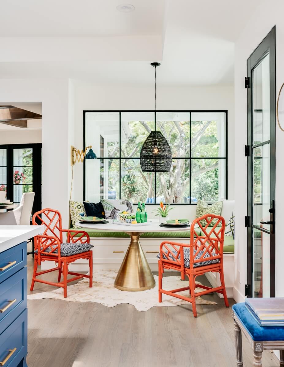 A breakfast nook seating area in the kitchen with a large pendant light.
