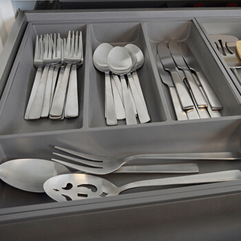 Modern stainless steel drawers and storage accessories for kitchen cabinets from Dura Supreme Cabinetry. From corner storage and beverage centers to space for cookware, cutlery, and spices, we’ll work with you to ensure your cabinets are designed to meet the unique performance needs of your space.