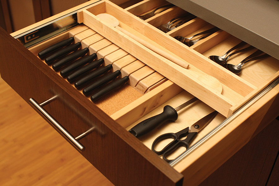Kitchen cabinet storage ideas for the prep zone area. The slotted Drawer Knife Holder can be hidden below a Two-Tier Cutlery Tray for maximum drawer use.