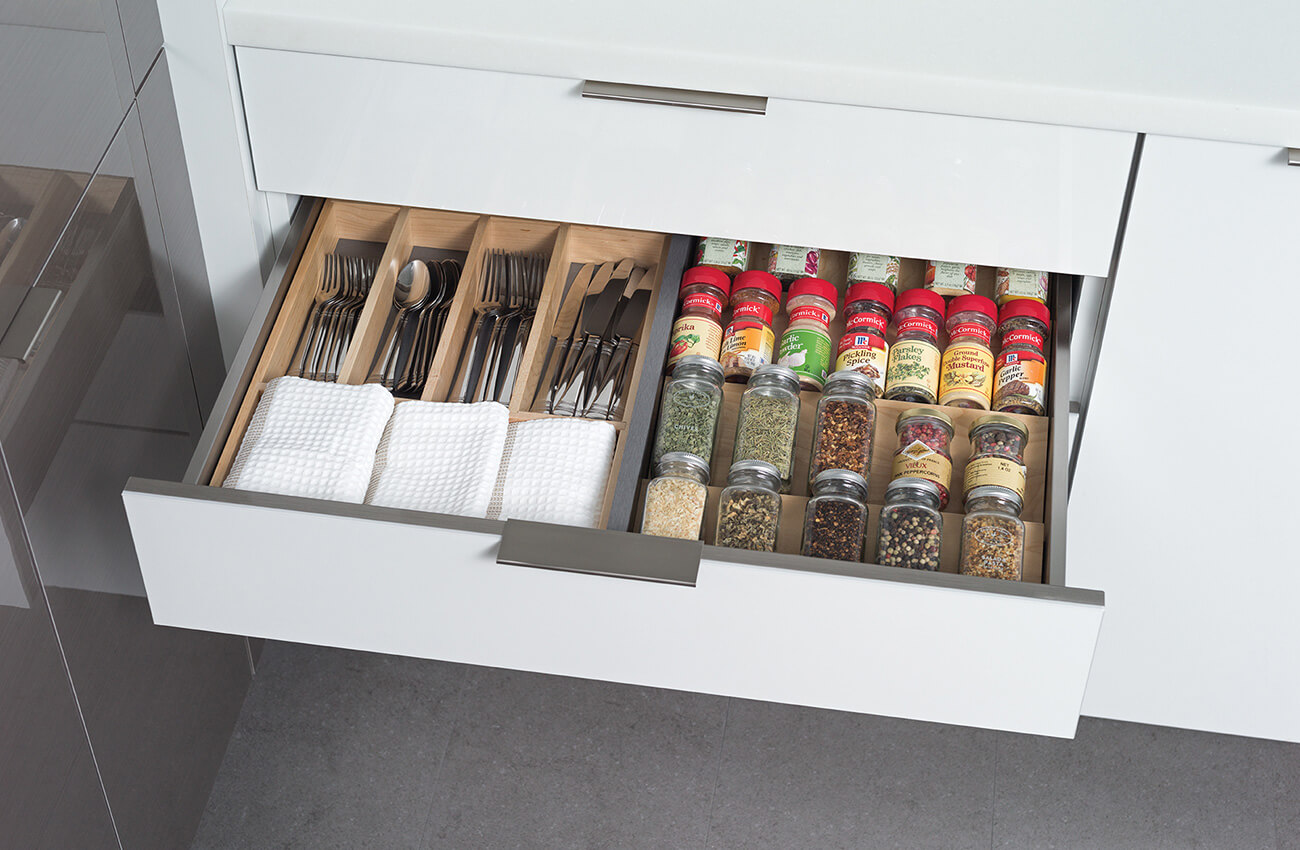 Discover kitchen cabinet storage solutiona that will improve the function and workflow in your new kitchen remodel. The kitchen drawer is multi-functional with drawer accessories from Dura Supreme Cabinetry.