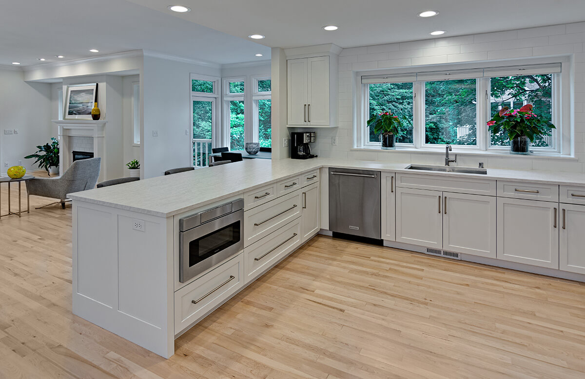 An island adds extra kitchen counter space to an L-shaped kitchen