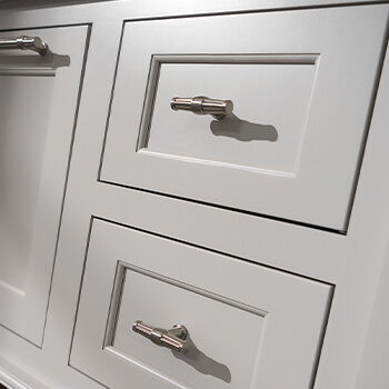Detailed inset cabinet doors on a bathroom vanity cabinet using Crestwood Cabinetry from Dura Supreme. An affordable premium cabinetry brand that includes both semi-custom and custom capabilities.