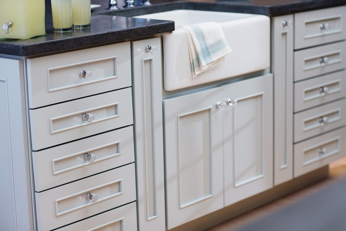 A light blue painted kitchen island in a cottage styled kitchen in a remodeled country home.