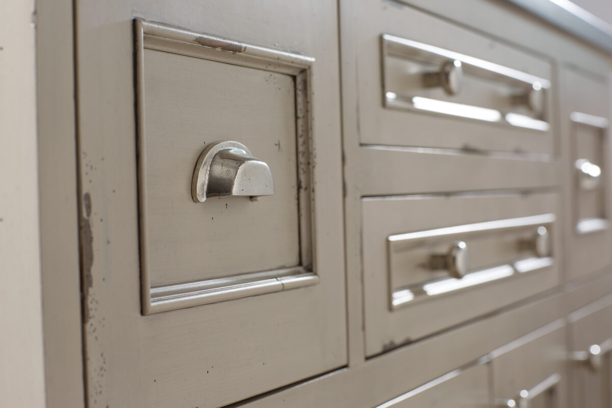 A furniture style kitchen island shown in Dura Supreme's Heritage Paint 