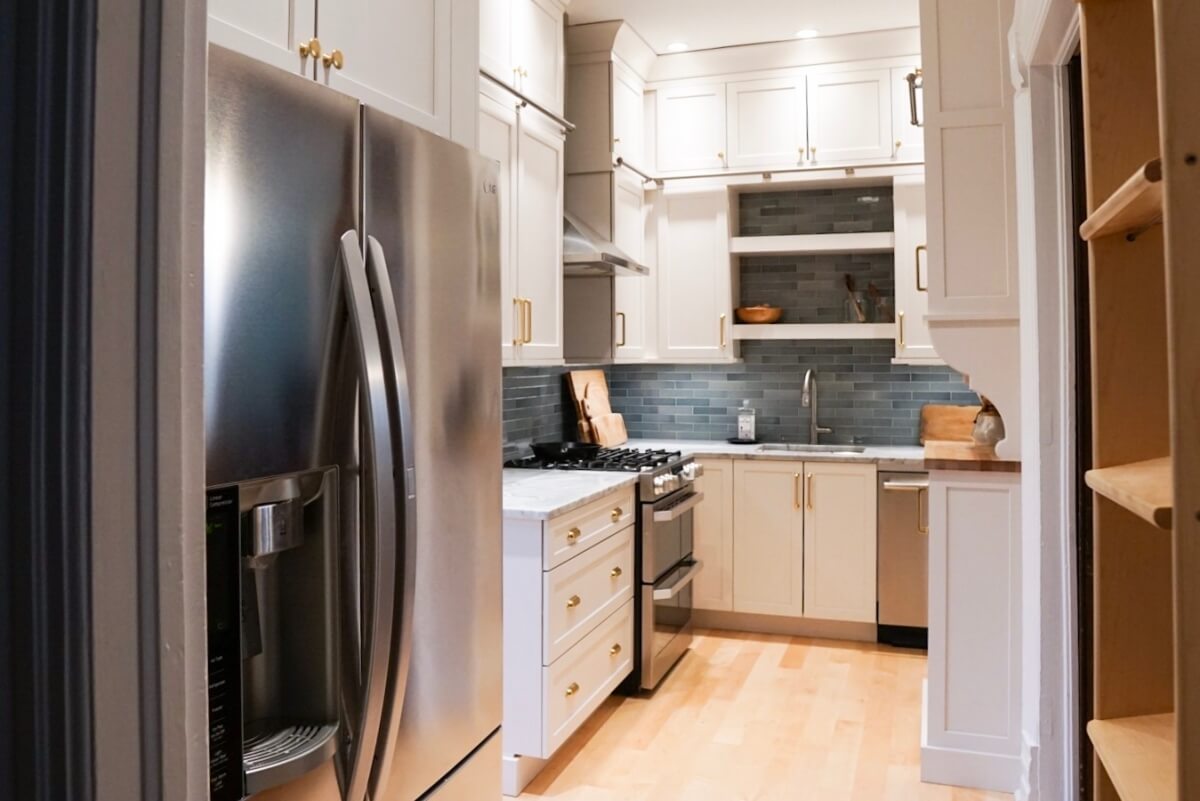 Here you can see a small glimpse of the mobile ladder to the right directly across from the refrigerator.