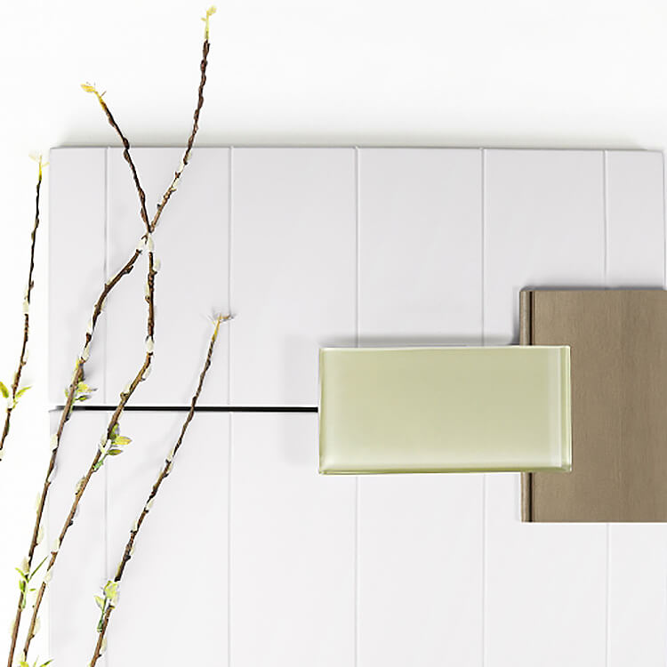 A natural color palette for a kitchen remodel using a shiplap door style in white paint with a light stained natural wood and a green subway tile.