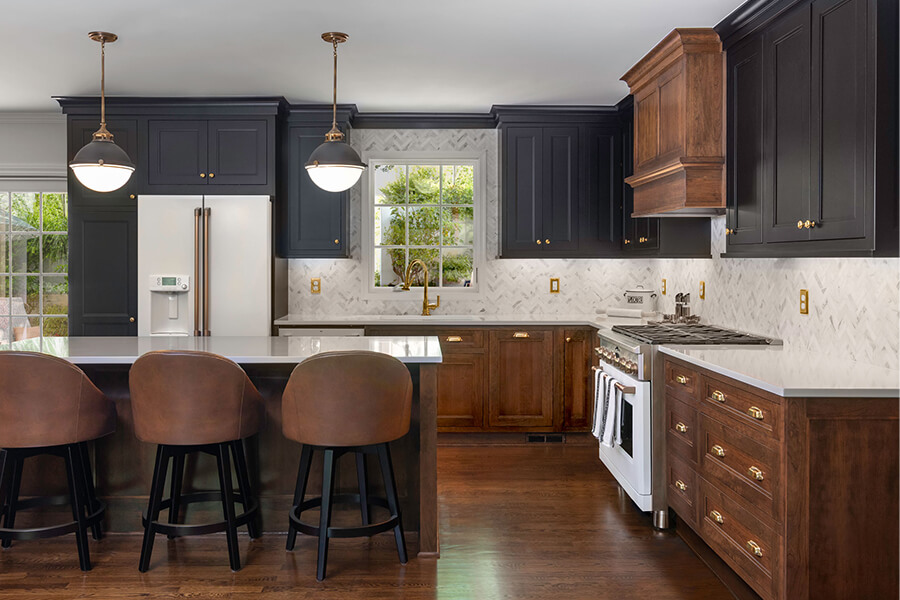 A new kitchen remodel with new black painted and cherry cabinets from Dutra Supreme.