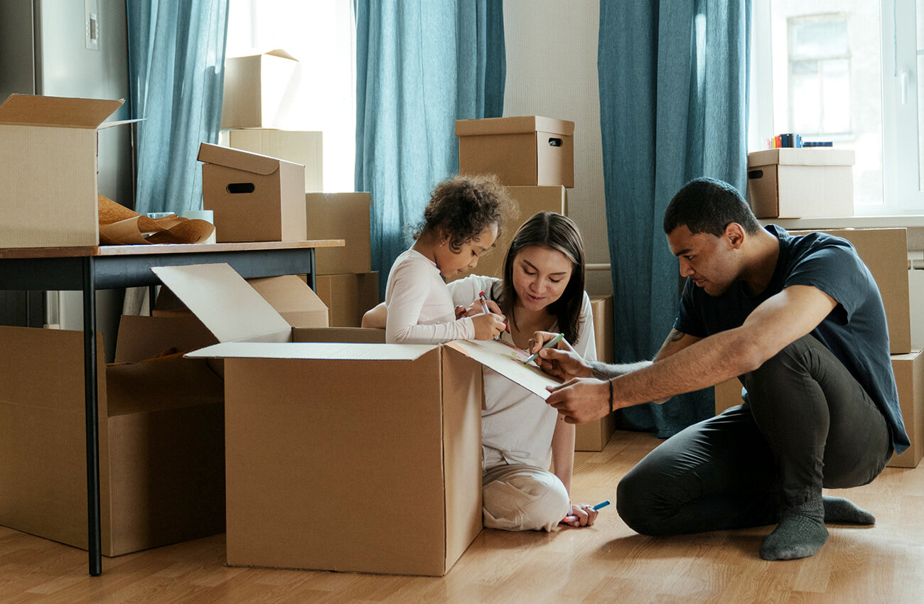 Before your current cabinets are torn out, you’ll first need to pack up your kitchen supplies. This young family is packing and labeling boxes to prepare for their remodel project.