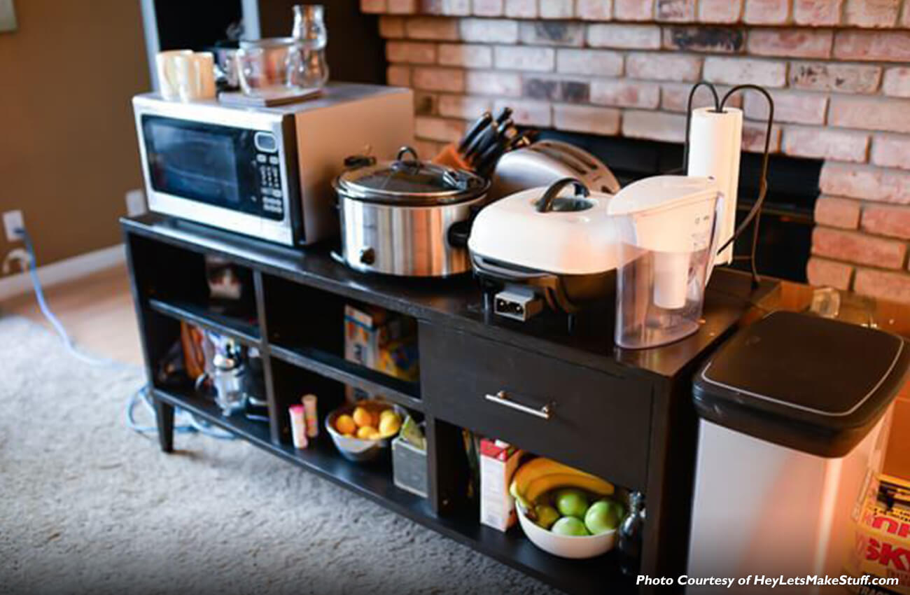 A temporary kitchen set up with all the basics to help this family be able to still make meals while the kitchen is under construction and being remodeled. Get tips for setting up a temporary kitchen space to surviving a remodel.