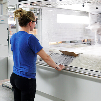 A Dura Supreme Cabinetry's factory Ventilation and filtering systems within our finish system ensure safe indoor and outdoor air quality, while dust collection systems ensure clean, dust-free air throughout the cabinet manufacturing facility.