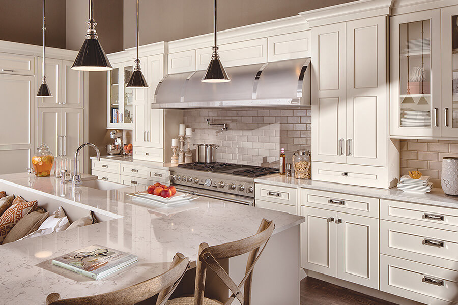 White on White is a mainstream color trend for kitchen designs all across the USA. The beautifully paired White cabinetry with White quartz countertops in this kitchen are a popular choice now and sure to be a long-time classic look for years to come. This kitchen has full overlay cabinet doors with a detailed flat panel cabinet door style.