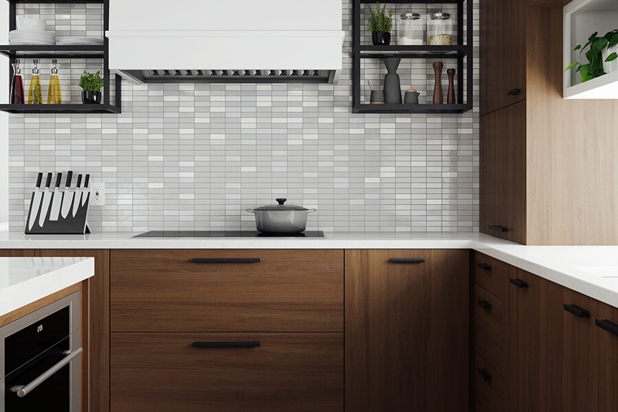 Black is an up-and-coming interiro design trend and color trend for kitchen designs. Black metal floating shelves are used in this modern walnut kitchen remodel as a bold accent around the white painted modern wood hood.