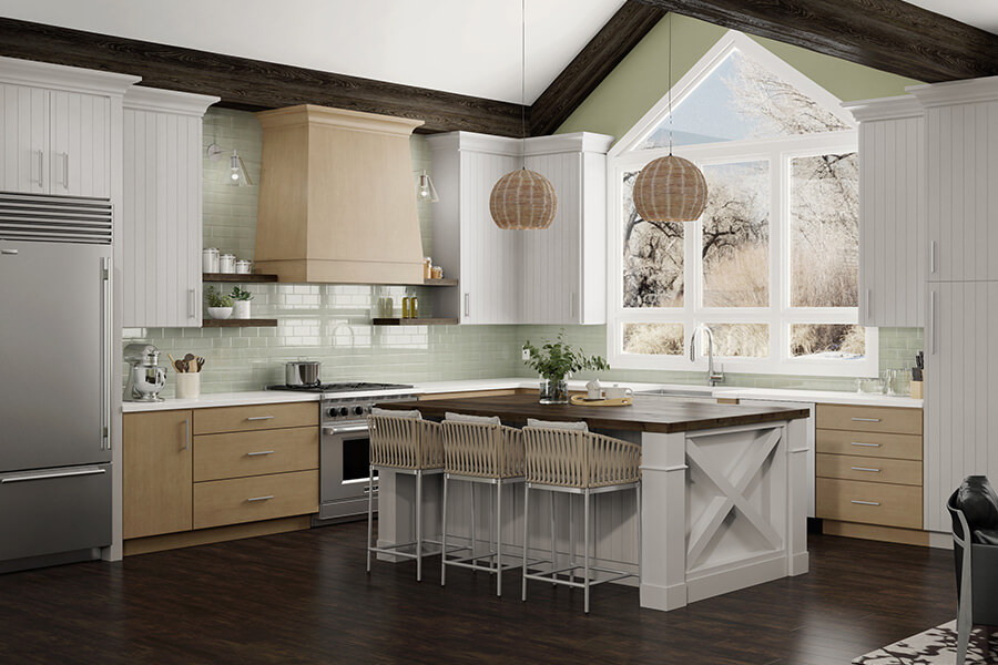 This Scandinavian-inspired kitchen located in the heart of Minnesota is full of delightful design details like an X kitchen island end cap, a tapered modern wood hood, and shiplap-like cabinet doors to name a few. The cabinetry in this kitchen features Dura Supreme’s Linea door style in Pearl paint combined with the Camden door style in a Cashew stain on Maple. The open floating shelves use Dura Supreme’s Caraway stain on Cherry.