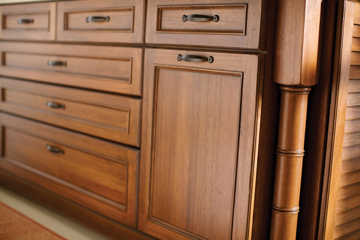 A bamboo-styled post is featured on this kitchen island to add hint of tropical flare. A custom stained finish was selected.