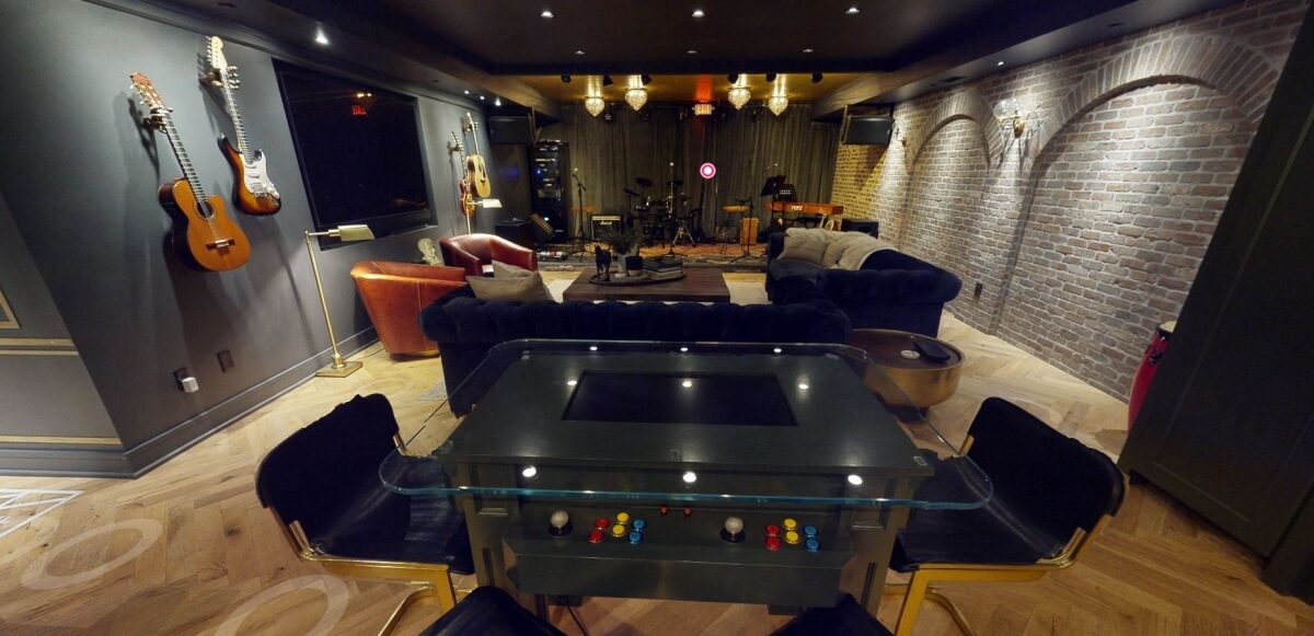 A basement remodel with a stage for musical performances.