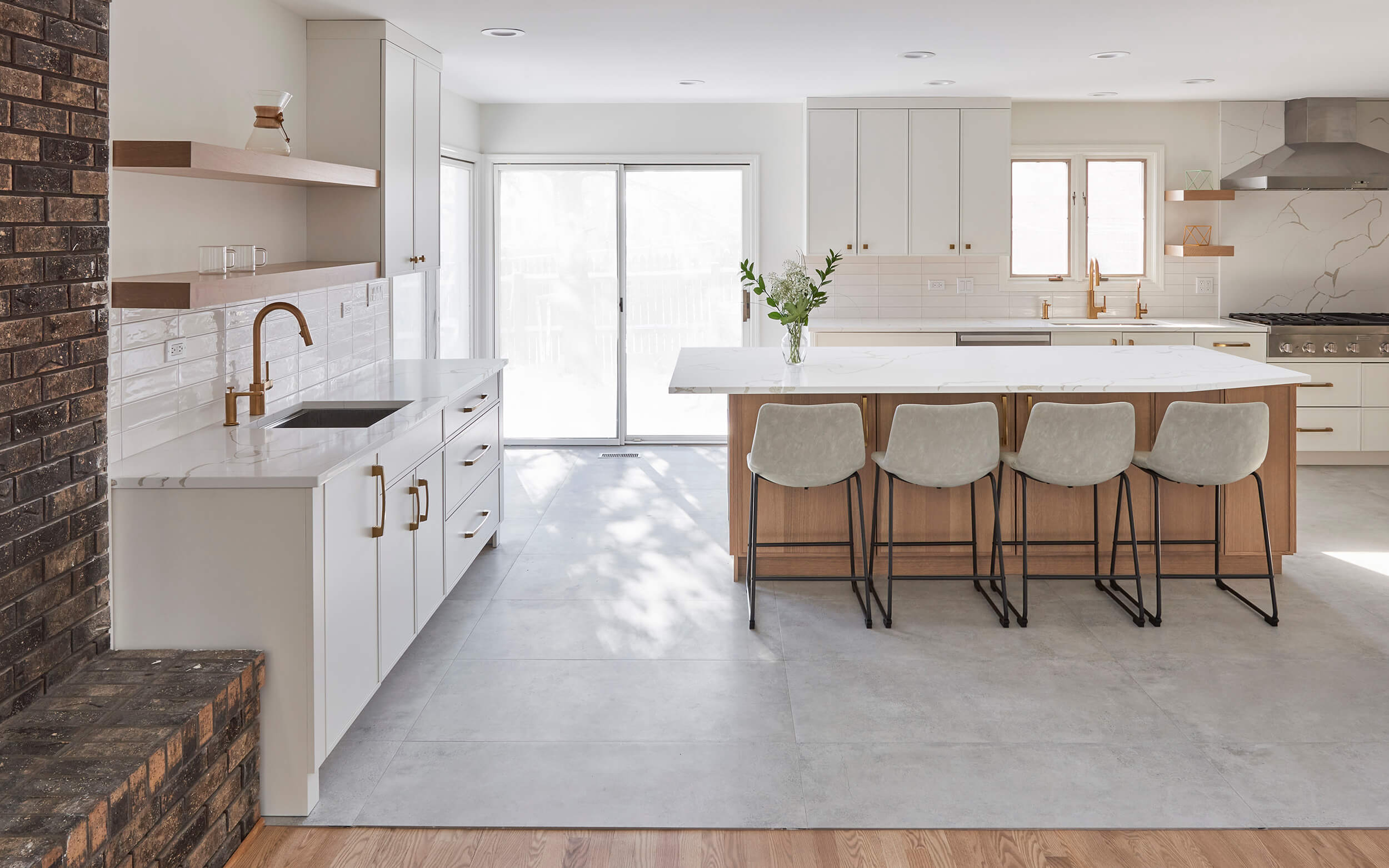 A bright white kitchen with a light, white oak kitchen island with Scandinavian style interior design and decor.