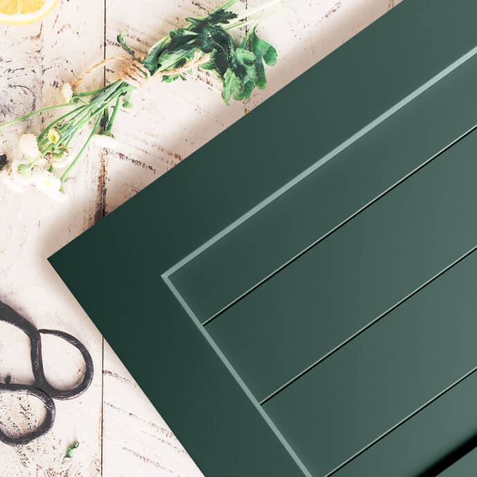 A deep forest green painted cabinet door with a shiplap styled center panel. Dura Supreme Cabinetry's Personal Paint Match Program offers the entire Sherwin-William’s paint palette AND Benjamin Moore paint palette , over 5,000 colors, for your new kitchen or bath cabinetry.