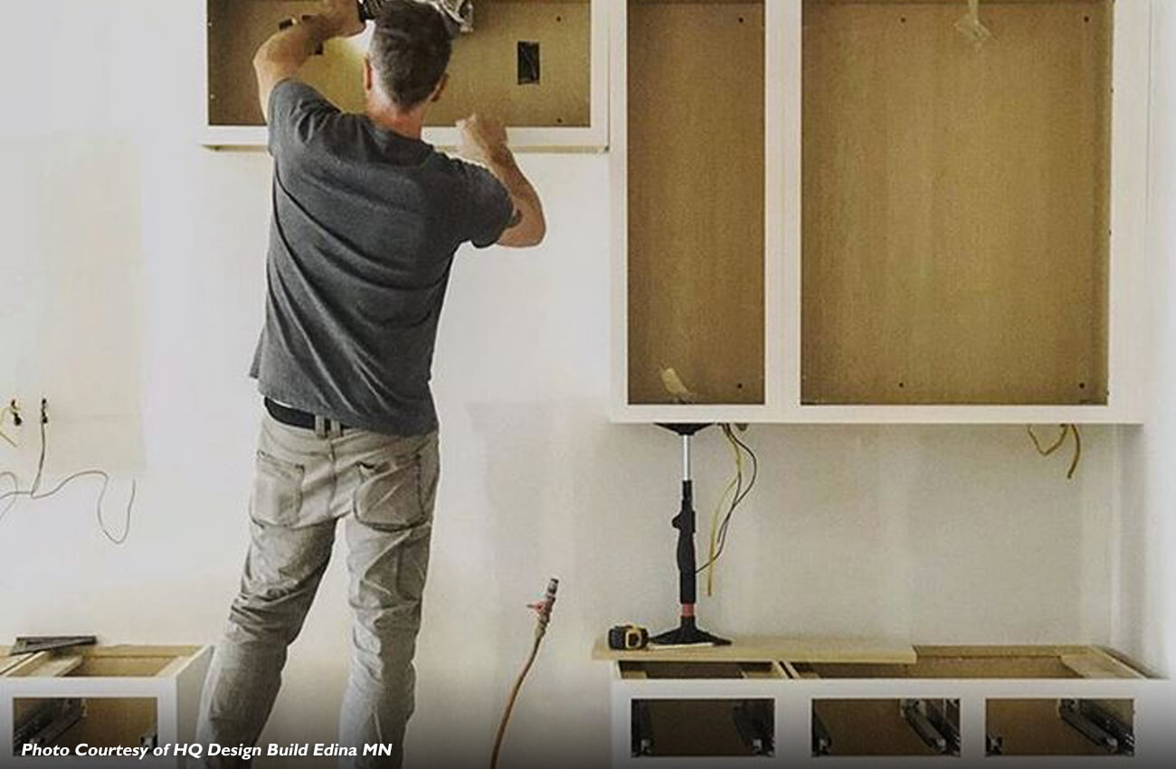 Cabinet installation during the kitchen remodel process.