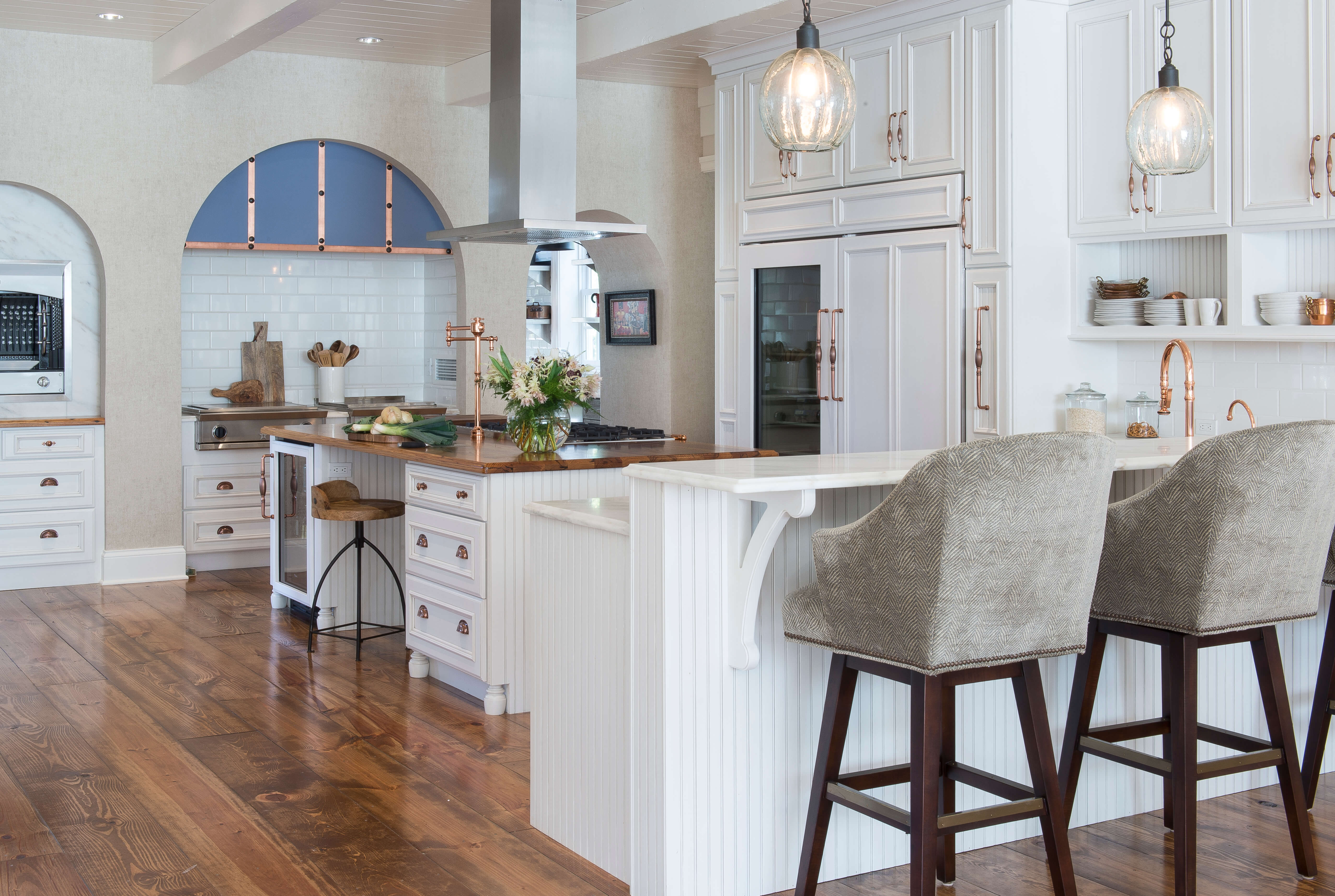 The breakfast bar has a 2-tier countertop to separate the dining space from the countertop near the sink for food prep.