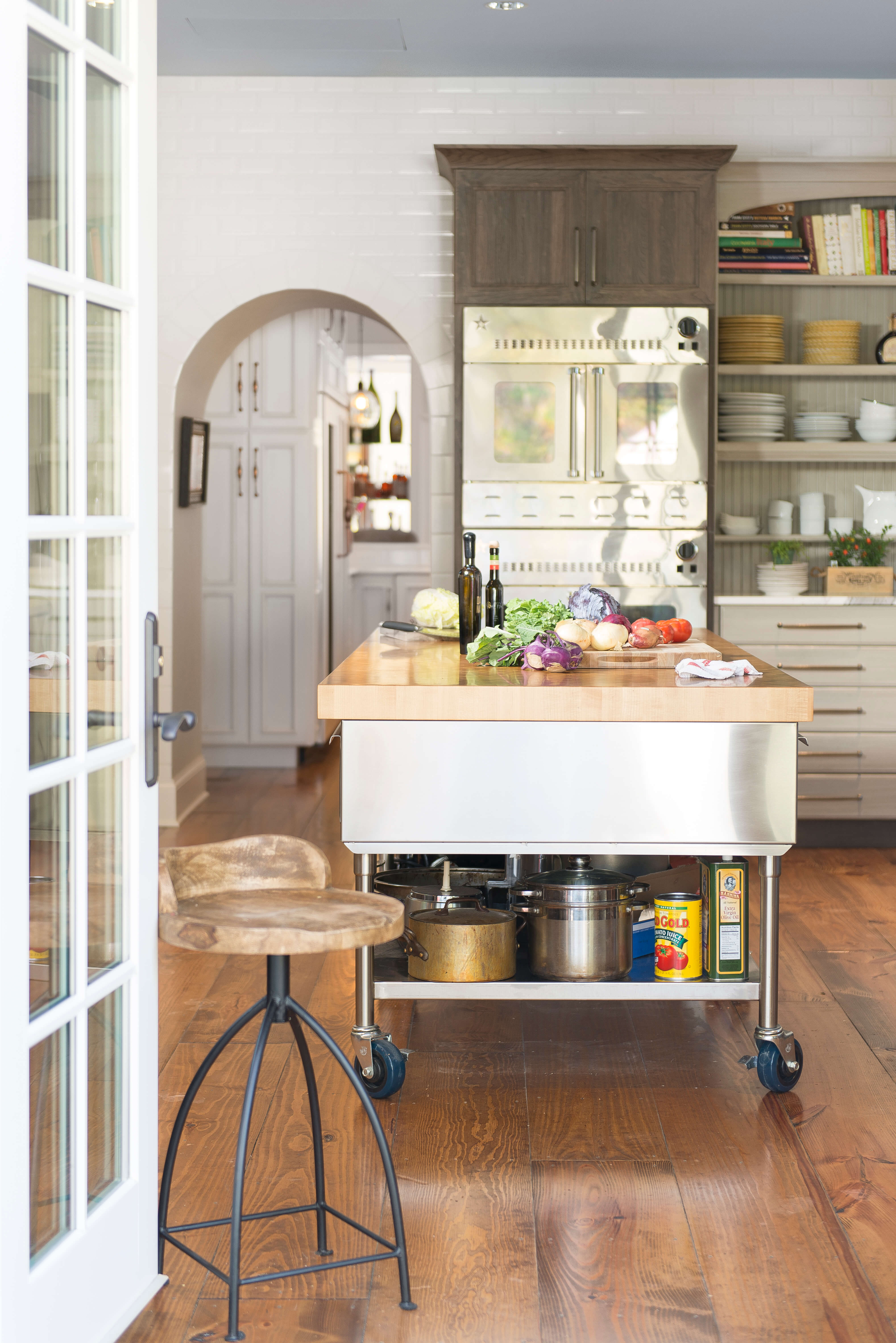 The garage door was replaced with French doors leading to the outdoor kitchen space.