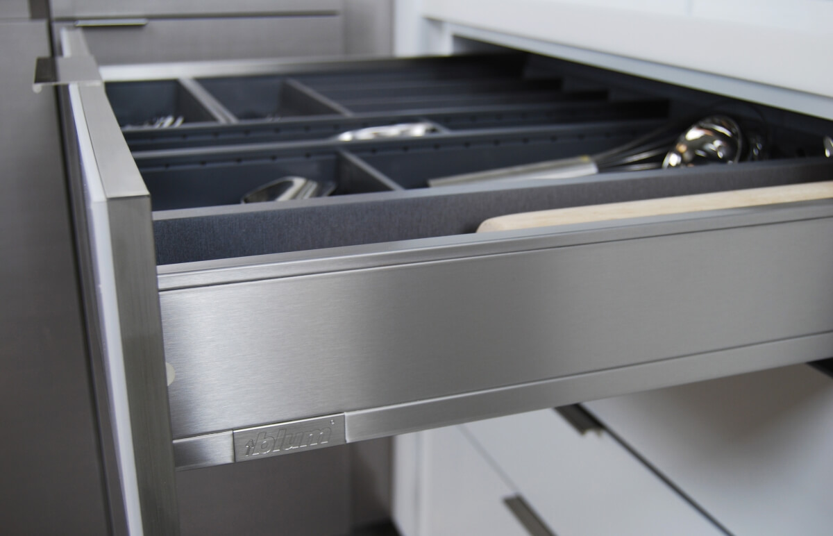 A sleek stainless steel drawer for Dura Supreme kitchen cabinets.