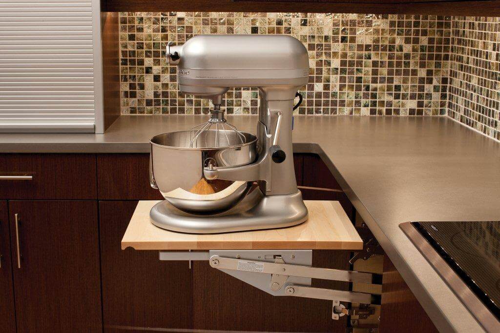 A Kitchenaid mixer or other heavy kitchen appliance can be lifted with ease to countertop level than conveniently stored in its own cabinet without straining your back! There's room for accessories and misc storage in the roll-out shelf below.