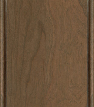 This finish color for Cherry kitchen & bath cabinets is shown in the Cashew stain with a Coffee glazed finish by Dura Supreme Cabinetry. A light to medium stain & glazed cabinet color with a brown-gray undertone.