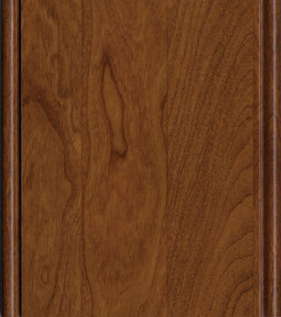 This finish color for Cherry kitchen & bath cabinets is shown in the Clove stained finish by Dura Supreme Cabinetry. This cabinet color has a rich, warm yellow-gold undertone.