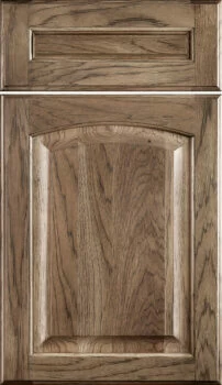 Hampton Classic is a traditional raised panel door with an arched raised panel. Shown in a Hickory wood with a medium true-brown stain color.