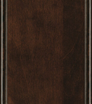 This finish color for Maple kitchen & bath cabinets is shown in the dark Java stain by Dura Supreme Cabinetry. This cabinet color is a deep, striking stain with a tint of a reddish undertone.