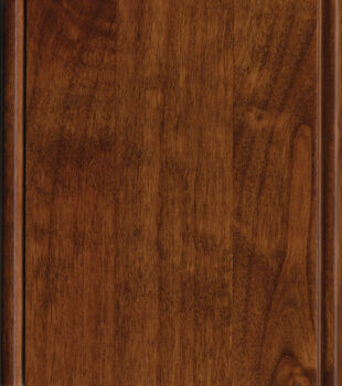 This finish color for rustic Knotty Alder kitchen & bath cabinets is shown in the brilliant Mission stain by Dura Supreme Cabinetry. This cabinet Arts & Crafts inspired color has a warm golden undertone with a tint of red.