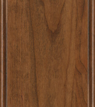 This finish color for Cherry kitchen & bath cabinets is shown in the warm Toast stain by Dura Supreme Cabinetry. A medium cabinet color with a natural, true-brown undertone.