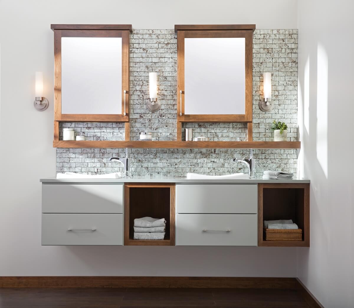Floating vanity with wall hung bathroom cabinets from Dura Supreme Cabinetry.