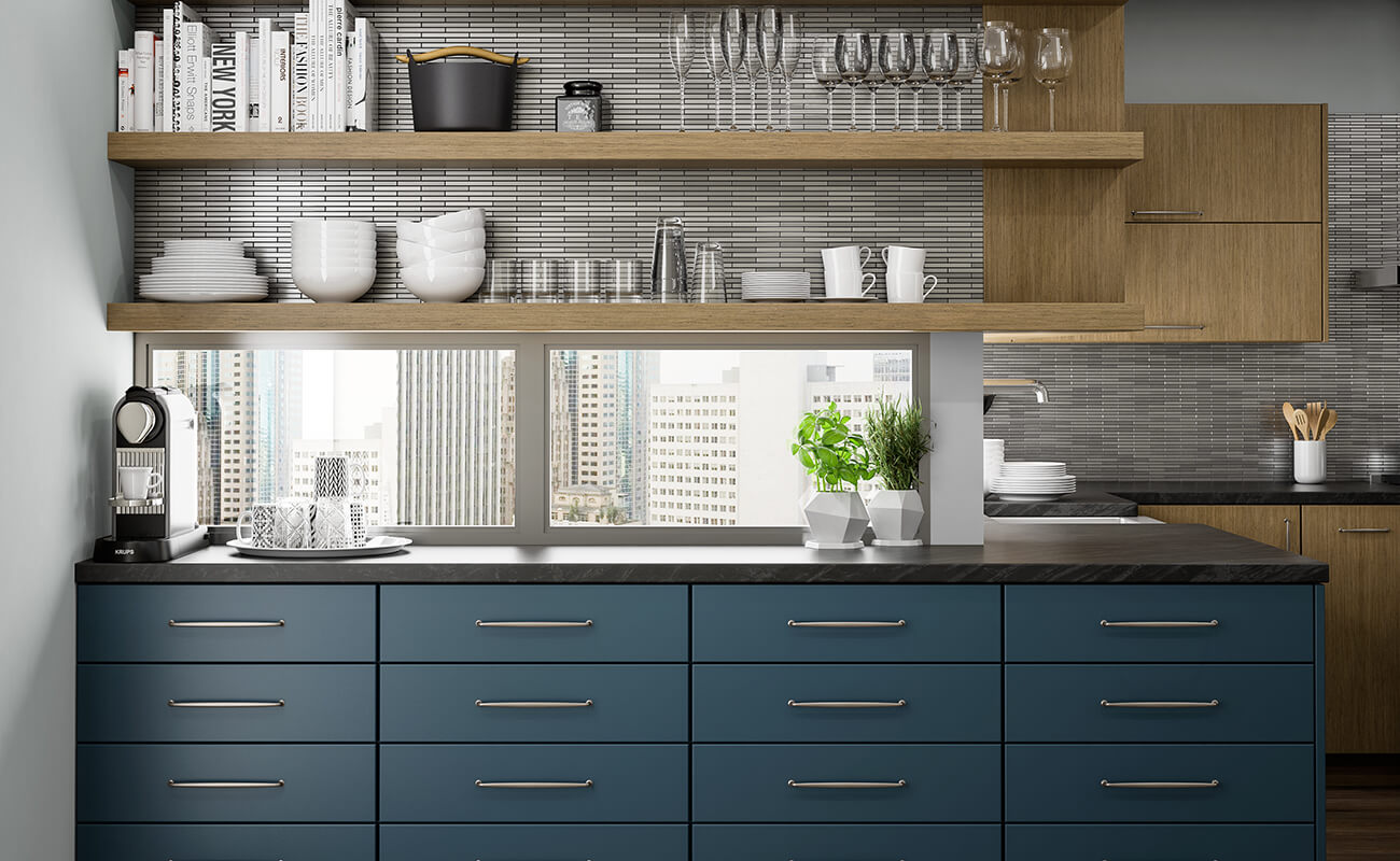 A trendy city condo kitchen with an urban skyline view with navy blue matte cabinets and drawers for the lower cabinets and straight grain white oak floating shelves instead of upper cabinets. A window backsplash helps capture the beautiful views of the city while also bringing extra natural light into the space.