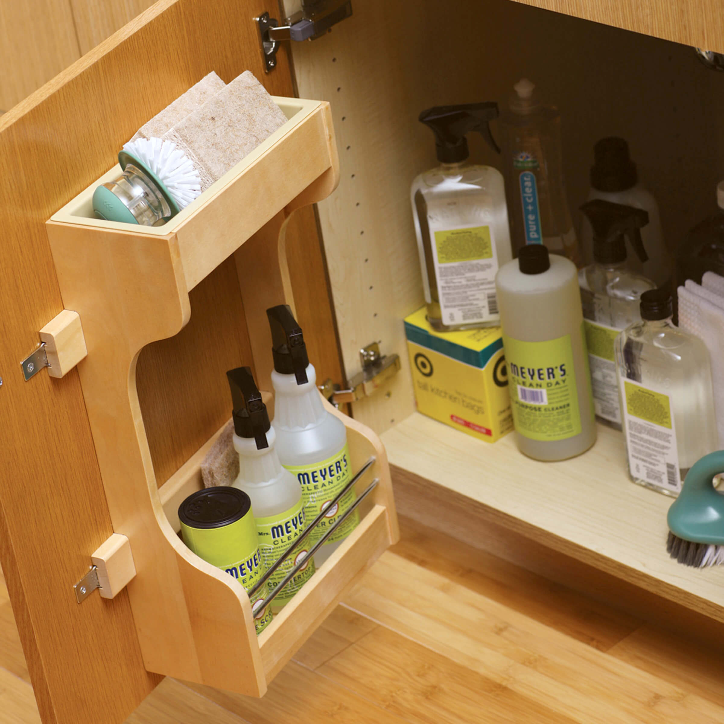 Dura Supreme’s convenient storage rack on the cabinet door organizes cleaning supplies and provides a space for you most used products to be close at hand.