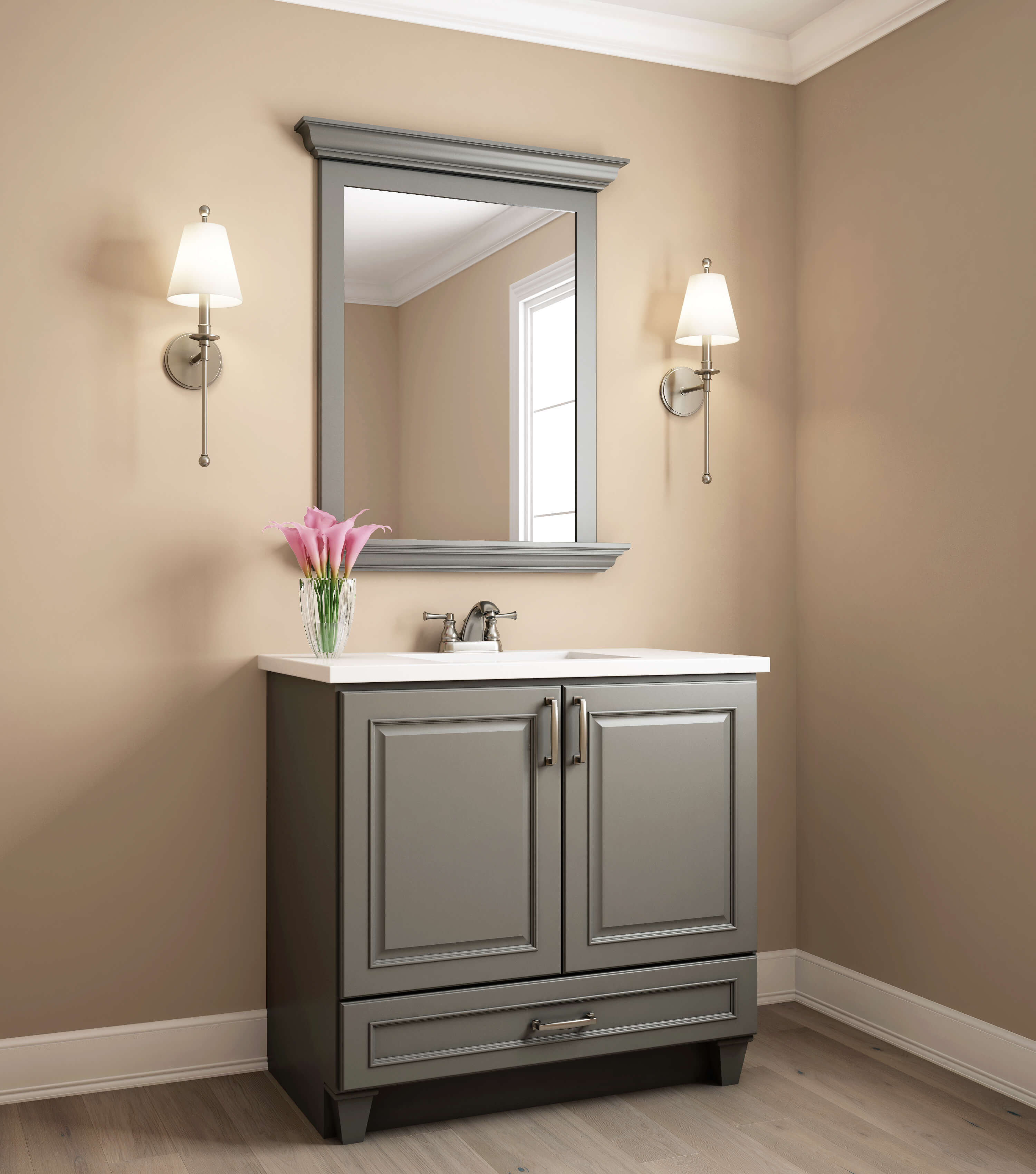 A small bathroom vanity and mirror with a gray-green painted finish with beige walls.