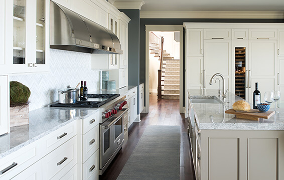 A testimonial about this beautiful white and beige, transitional styled kitchen with Dura Supreme's Semi-Custom cabinets.